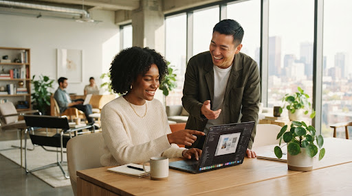 Two diverse creative tech professionals collaborating happily